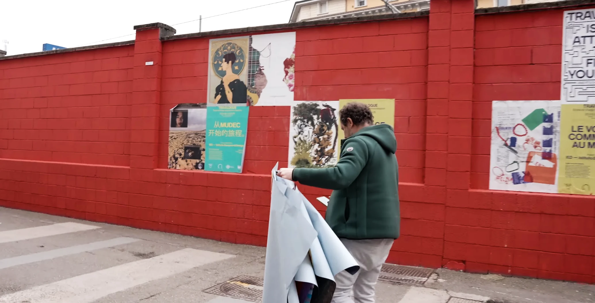 MUDEC poster photographed in the street